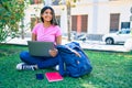 Young latin student girl smiling happy using laptop at university campus Royalty Free Stock Photo