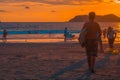 Young latin teenager holding a surfboard on a beautiful afternoon on the beach of the tropical Pacific in the Manuel Antonio