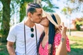 Young latin tourist couple hugging and kissing at the park Royalty Free Stock Photo