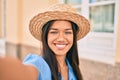 Young latin tourist girl on vacation smiling happy making selfie by the camera at the city Royalty Free Stock Photo