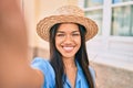 Young latin tourist girl on vacation smiling happy making selfie by the camera at the city Royalty Free Stock Photo