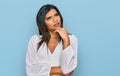 Young latin transsexual transgender woman wearing casual clothes thinking worried about a question, concerned and nervous with Royalty Free Stock Photo