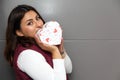 Young latin woman with box of heart chocolates. Valentine`s Day Royalty Free Stock Photo