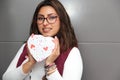 Young latin woman with box of heart chocolates. Valentine`s Day Royalty Free Stock Photo