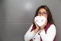 Young latin woman with box of heart chocolates. Valentine`s Day Royalty Free Stock Photo