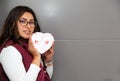 Young latin woman with box of heart chocolates. Valentine`s Day Royalty Free Stock Photo