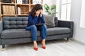 Young latin woman depressed having psychology session at psychology center Royalty Free Stock Photo