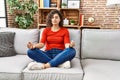 Young latin woman doing yoga exercise at home Royalty Free Stock Photo