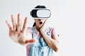 Young latin woman with glasses of virtual reality on a white background. Future technology concept. Modern imaging technology in Royalty Free Stock Photo