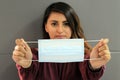 Young latin woman with multilayer face masks for clinical use to prevent covid