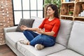 Young latin woman smiling confident doing yoga exercise at home Royalty Free Stock Photo