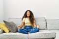 Young latin woman smiling confident doing yoga exercise at home Royalty Free Stock Photo