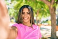 Young latin woman smiling happy making selfie by the camera at the park Royalty Free Stock Photo