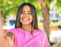 Young latin woman smiling happy making selfie by the camera at the park Royalty Free Stock Photo