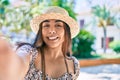 Young latin woman on vacation smiling happy making selfie by the camera at street of city Royalty Free Stock Photo