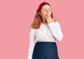 Young latin woman wearing waitress apron bored yawning tired covering mouth with hand