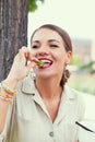 Young Latina woman eating fresh lettuce Royalty Free Stock Photo