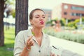 Young Latina woman enjoying eating fresh salad at public park Royalty Free Stock Photo