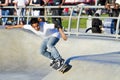 Young Latino Male Performing At Skateboard Par