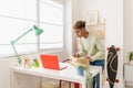 Young latino seller man preparing second hand package before sending to buyer Royalty Free Stock Photo