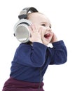 Young laughing child with ear-phones Royalty Free Stock Photo