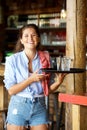 Young laughing female server with tray of drinks Royalty Free Stock Photo