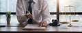 Young lawyer business man working with paperwork on his desk in office workplace for consultant lawyer concept of Royalty Free Stock Photo