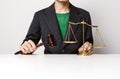 Young lawyer holding wooden gavel working.