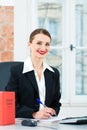 Lawyer in office making notes in a file Royalty Free Stock Photo