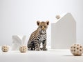 Young leopard cub in a studio photoshoot, skillfully lit against a clean backdrop.