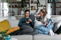 Young lesbian couple at home have a problem and argue due to jealousy caused by chatting and flirting via social media networks on