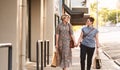 Young lesbian couple walking with shopping bags in the city Royalty Free Stock Photo