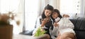 Young Lesbian couple are watching a movie on a computer tablet while sitting together on the sofa Royalty Free Stock Photo