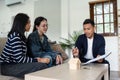 young lesbian married couple discussing agreement with skilled real estate agent or broker. Professional financial Royalty Free Stock Photo