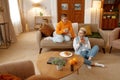 Young lgbt woman couple drinking coffee planning future while resting at home