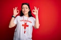 Young lifeguard woman wearing secury guard equipent over red background relax and smiling with eyes closed doing meditation