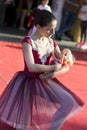 Graceful Expression: Young Little Ballerina Embracing World Dance Day on the Public Stage
