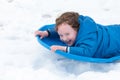 Young little boy enjoying sledding outside on a snow day Royalty Free Stock Photo