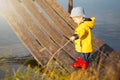 Young little boy fishing from wooden dock Royalty Free Stock Photo