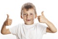 Young little boy isolated thumbs up on white