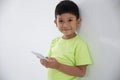 Young little boy using smart phone Royalty Free Stock Photo