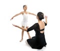 Young little girl ballerina learning dance lesson with ballet teacher