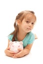 Young little girl holding a piggy bank Royalty Free Stock Photo