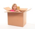 Young little girl sitting inside box Royalty Free Stock Photo