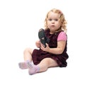 Young little girl sitting over isolated white background Royalty Free Stock Photo