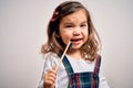 Young little infant girl brushing her teeth using tooth brush and oral paste, cleaning teeth and tongue as healthy health care Royalty Free Stock Photo