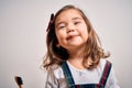 Young little infant girl brushing her teeth using tooth brush and oral paste, cleaning teeth and tongue as healthy health care Royalty Free Stock Photo