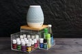 Young living essential oil bottles are neatly stored in an acrylic box