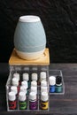 Young living essential oil bottles are neatly stored in an acrylic box