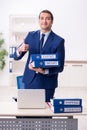 Young male logistics specialist working in the office Royalty Free Stock Photo